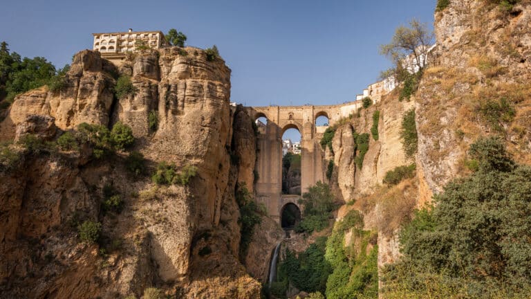 View of Ronda city, Malaga province, Andalusia, Spain. The Puente Nuevo "New Bridge" connects the two sides of the city by crossing the the Guadalevรญn river canyon also known as El Tajo canyon.
