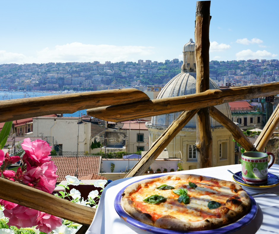 pizza overlooking the naples skyline, the birthplace of pizza