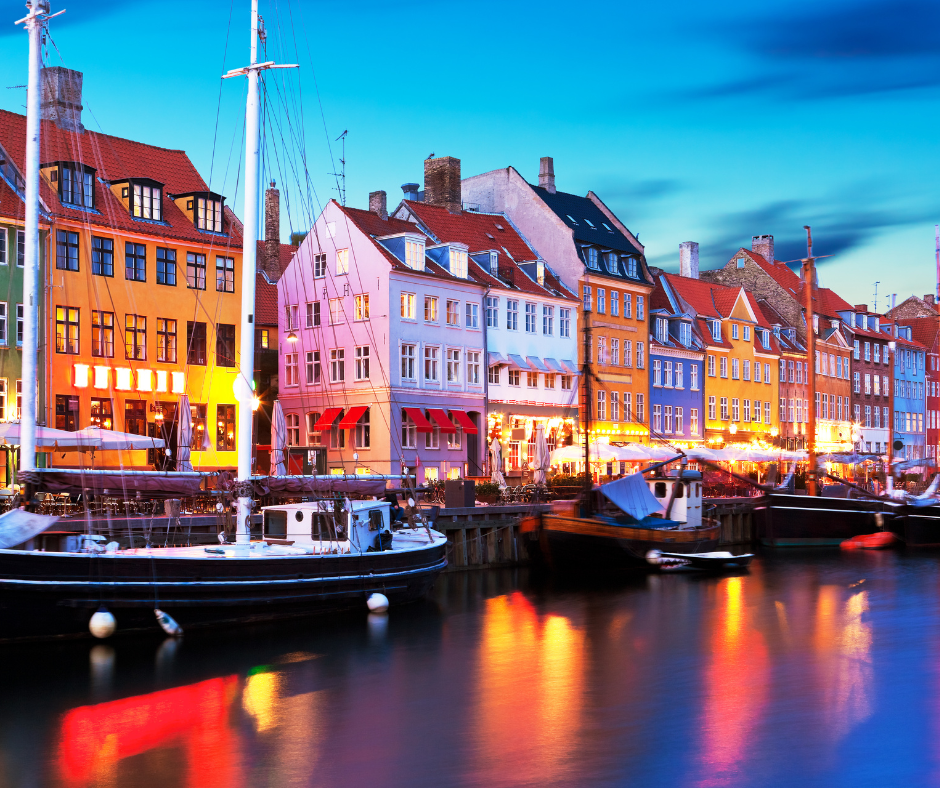 Sunset over Copenhagen’s iconic harbor, capturing the charm of Denmark tourism and sustainable travel Europe 2025.