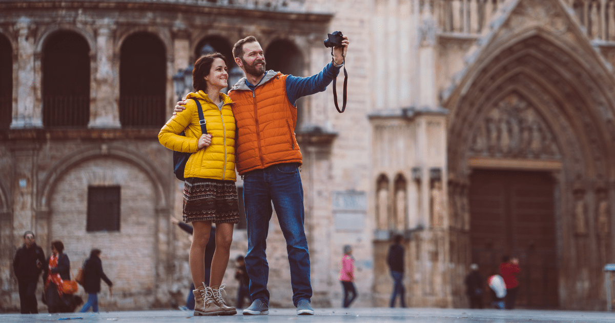 young couple exploring plaza de la virgen, valencia