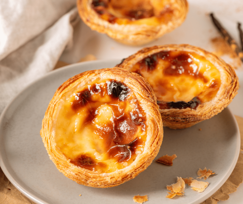 golden brown pastel de nata, traditional portuguese egg custard pastries